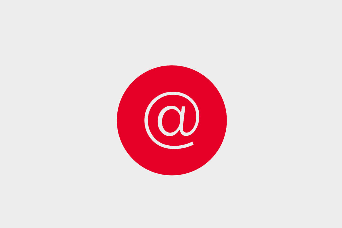 Red circle with a white @ symbol in the center on a light gray background.