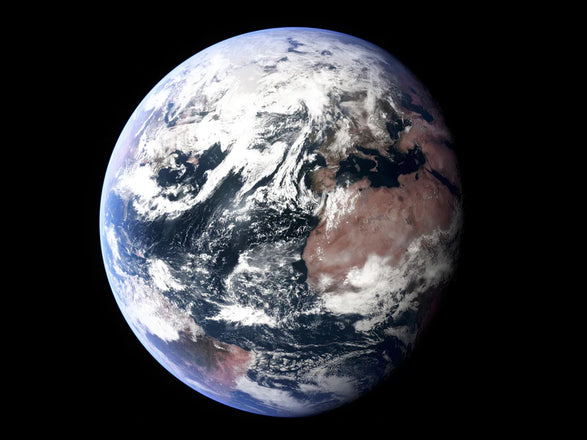 View of Earth from space showing clouds, oceans, and continents, including Africa and parts of Europe and Asia.