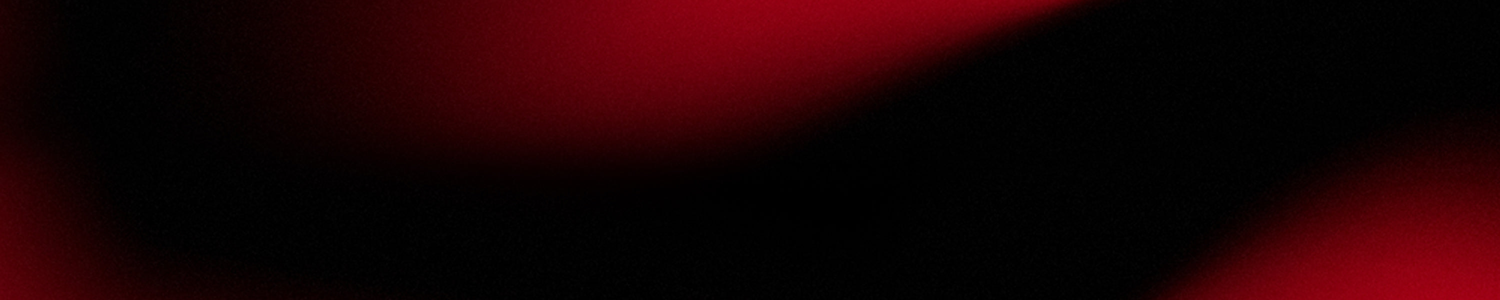 Abstract image with smooth black and red gradient shapes blending together across the frame.